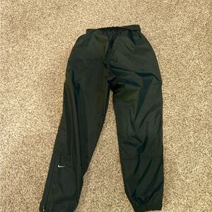 dark green Nike track windbreaker pants
